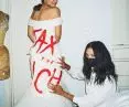 Alexandria Ocasio-Cortez in a gown prepared for the MET Gala 2021, which bore the inscription 