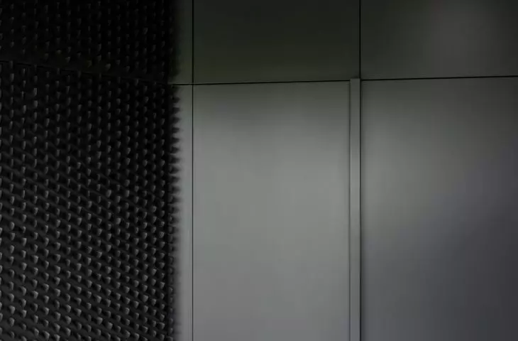 The black wall is made up of kitchen spatulas