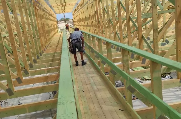 Prefabricated trusses - commercial building - attic space with working deck
