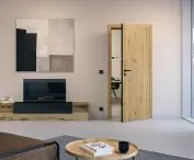 BaseLine rebate-free wooden door, with structured Duradecor surface in light oak and board edge in black and LineaPlanar black.edition handle
