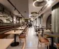 Oblique mirrors optically enlarge the interior