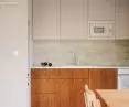 The kitchen is kept in subdued colors