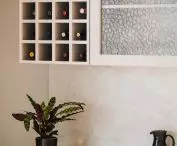 The arrangement refers to the retro style, ornamental glass in the bar