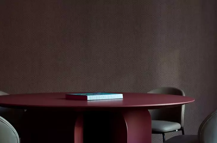 the wall is covered with graphic wallpaper 