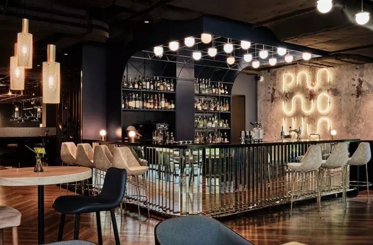Bar area with neon POW sign