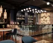 Bar area with neon POW sign