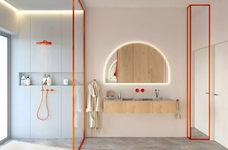 Subdued tones of the bathroom were broken with orange elements