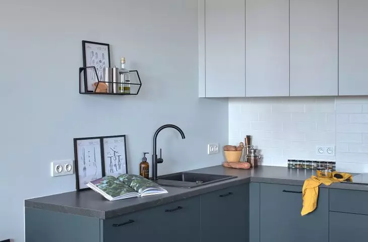 The kitchen matches the rest of the apartment in color