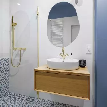 The bathroom is kept in shades of blue and white