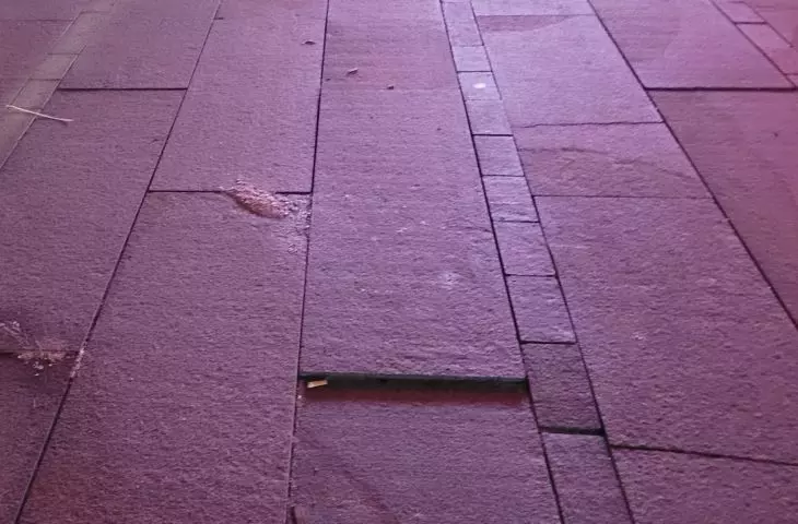 Damaged MTP plaza floor - December 2022.