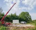 Installation of the walls of the house in the heavy German system; it takes about a week to erect a closed state (on a previously prepared foundation slab)
