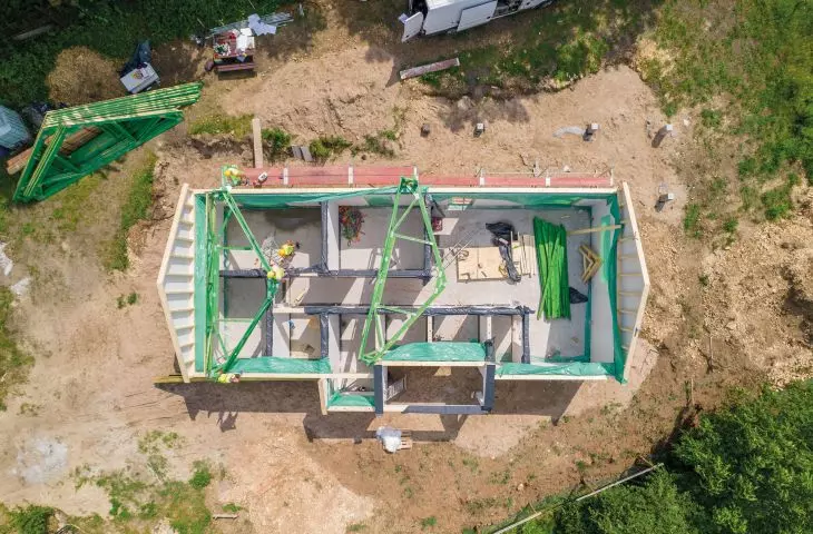 Installation of the walls of the house in the heavy German system; it takes about a week to put the shell of the house closed (on a previously prepared foundation slab)