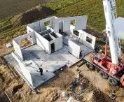 walls of a house made of prefabricated expanded clay are built quickly - on the construction site the walls are assembled from ready-made elements