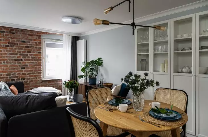 The dining area features Viennese plaid chairs