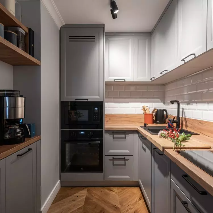 The kitchen is decorated in gray colors 