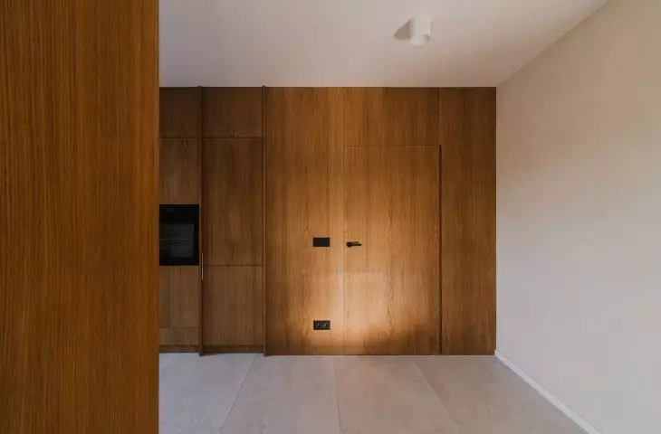 the kitchen is almost entirely sunk in wood 