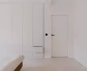 the bedroom is dominated by white