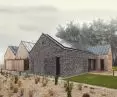 The subdued facade consists of wooden planks and hand-formed brick