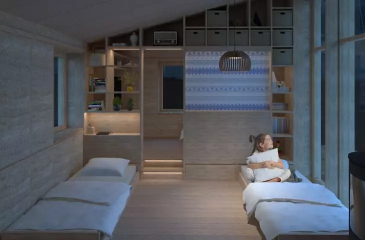 The sleeping spaces were separated by the author with built-ins for storing things and fabric