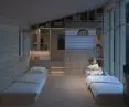 The sleeping spaces were separated by the author with built-ins for storing things and fabric