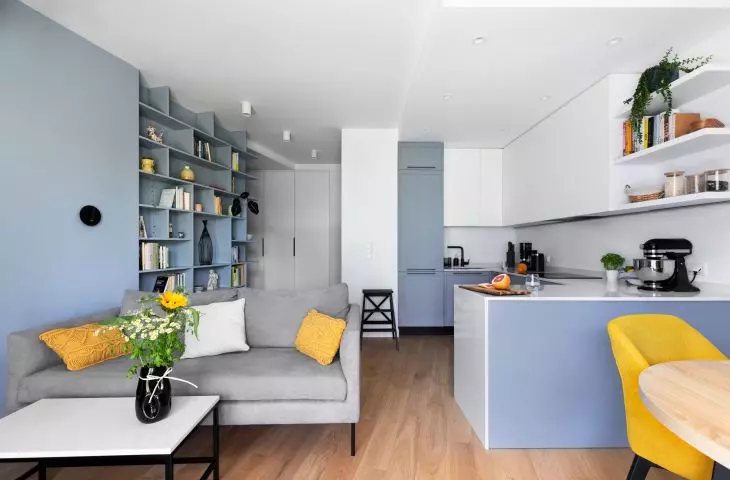 The living area combines the kitchen, dining area and living room