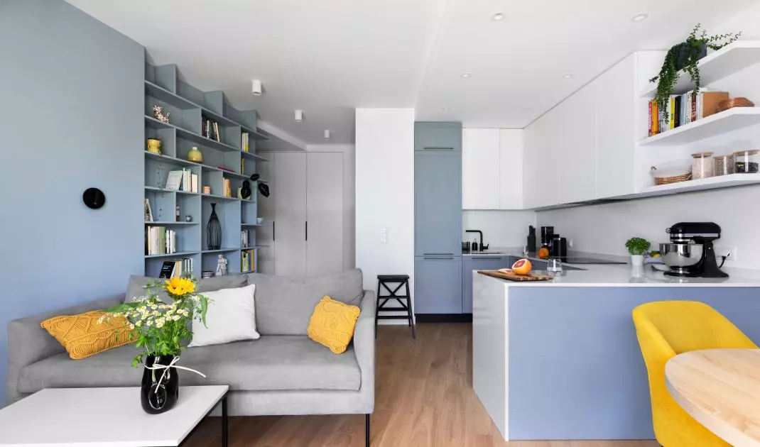 The living area combines the kitchen, dining area and living room