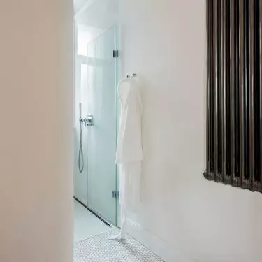The chimney in the bathroom marks the bathing area