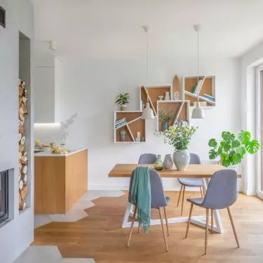 The fireplace is located in the center of the living area