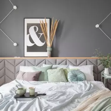 Bed with upholstered headrest 