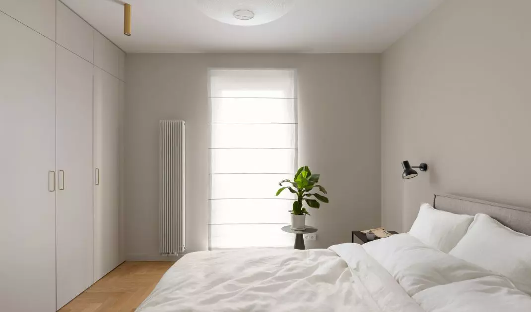 The bedroom was decorated in neutral colors