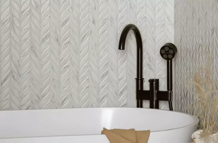 There is a ceramic mosaic on the wall
