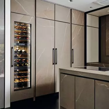 Furniture fronts and kitchen worktop finished with Laminam quartz sinter from IN-SIDE Pietra Piasentina Taupe collection