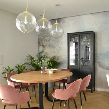 Dining room with pink chairs 