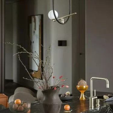 An original lamp hangs over the island
