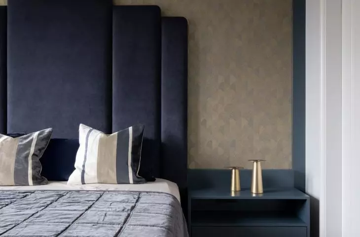 Bed with upholstered headrest