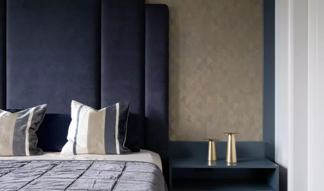 Bed with upholstered headrest