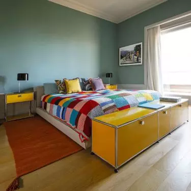 Bedroom with yellow cabinets 