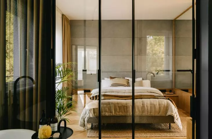 glass wall between bedroom and bathroom