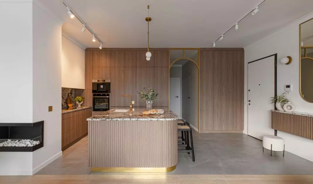 The kitchen is color-matched to the rest of the room 