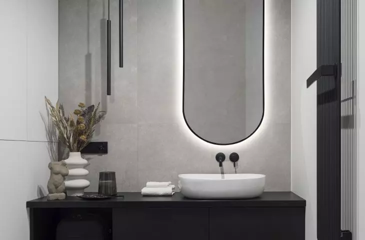 Arcade mirror in black frame illuminated