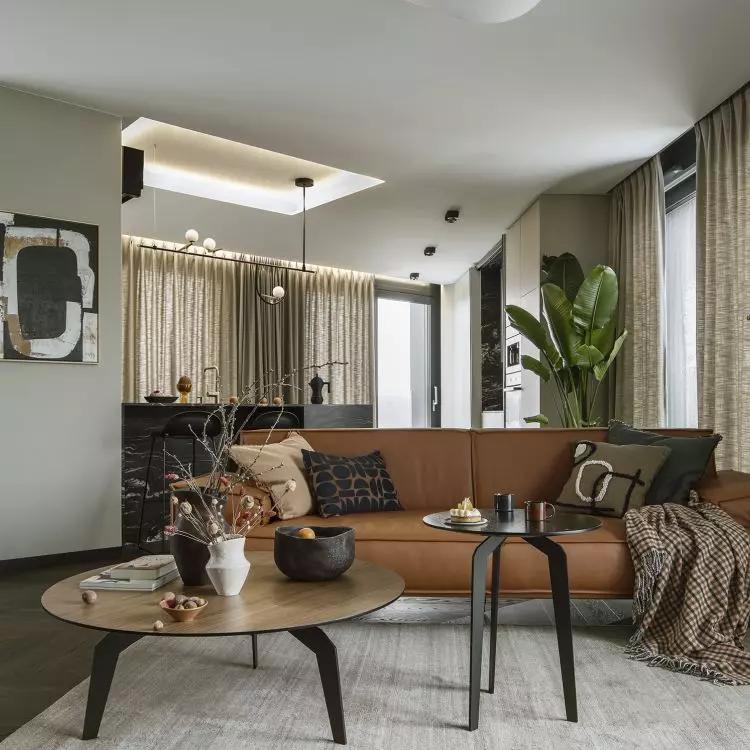 The living room area is defined by a carpet