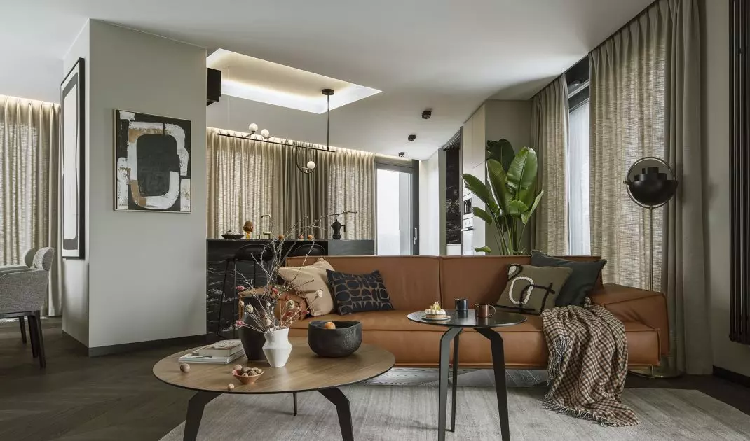 The living room area is defined by a carpet
