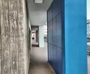 A kindergarten in Opole, the blue wall has storage compartments for toys