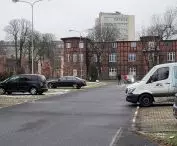 The area of the former barracks, the parking lot and the view of the squadron building, in the background the skyscraper of the Grunwald Housing Cooperative