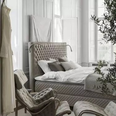 DUX Xcluzive bed and Pernilla 66 armchair