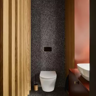 Maroon accents in the bathroom