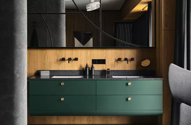 Dark green cabinets in the bathroom