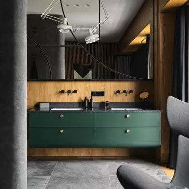 Dark green cabinets in the bathroom
