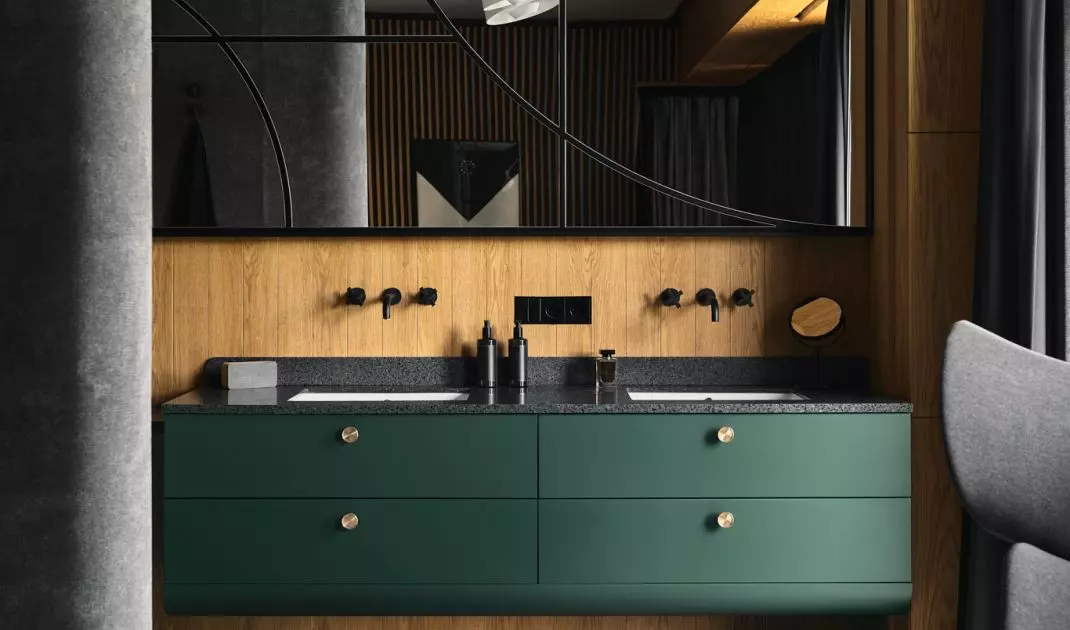 Dark green cabinets in the bathroom
