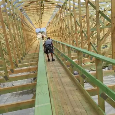 Prefabricated trusses - commercial building - attic space with working deck 